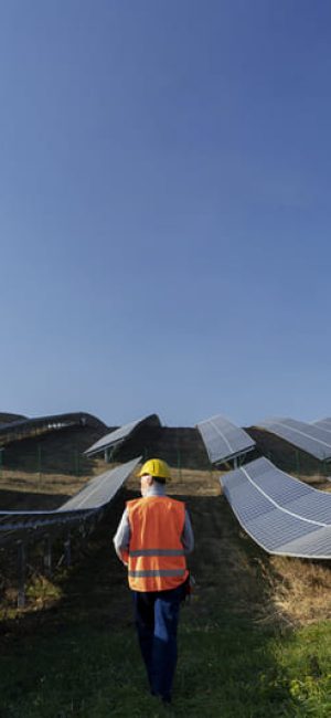 person-near-alternative-energy-plant